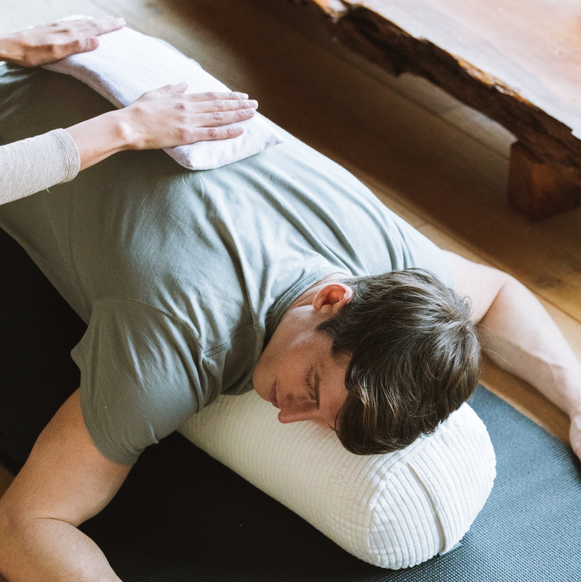 Halfmoon Hot + Cold Therapy Pillow on man's back